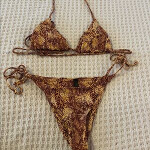 Out from under snake print bathing suit